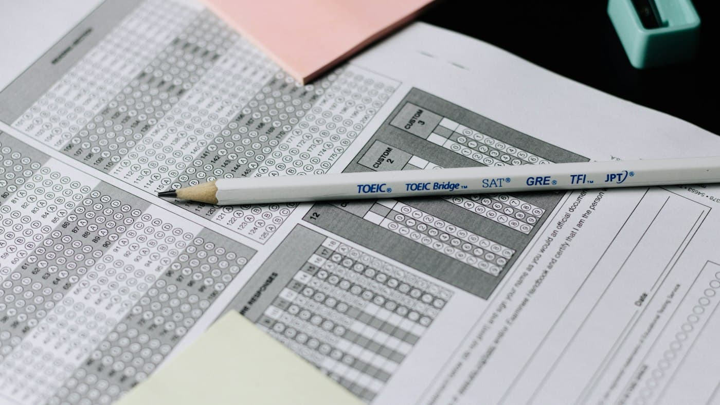 Pencil resting on an answer sheet during IELTS practice and band score testing