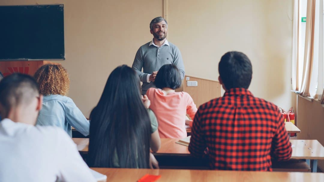 Teacher asking concept checking questions to a class of English language learners